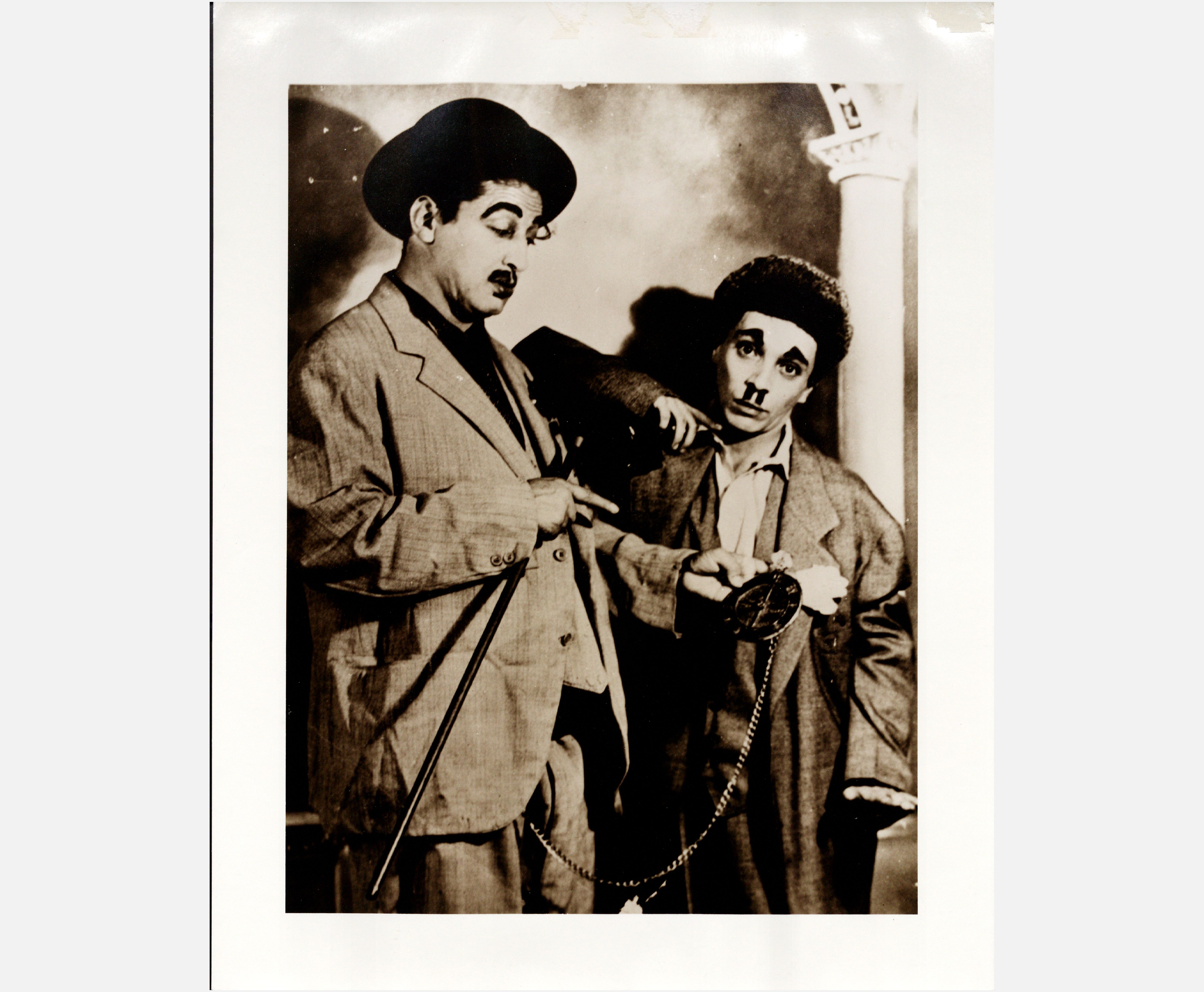 [Photograph of two male actors in costume; comedy duo of vaudeville Don Lalo and Don Suave, Leonardo García Astol and [name unknown]. Photograph taken at Teatro Nacional in San Antonio, Texas]<br><br> [Fotografía de dos actores disfrasados; el duo de vodevil Don Lalo y Don Suave, Leonardo García Astol y [nombre desconocido]. La fotografía fue tomada en el Teatro Nacional de San Antonio, Texas]
