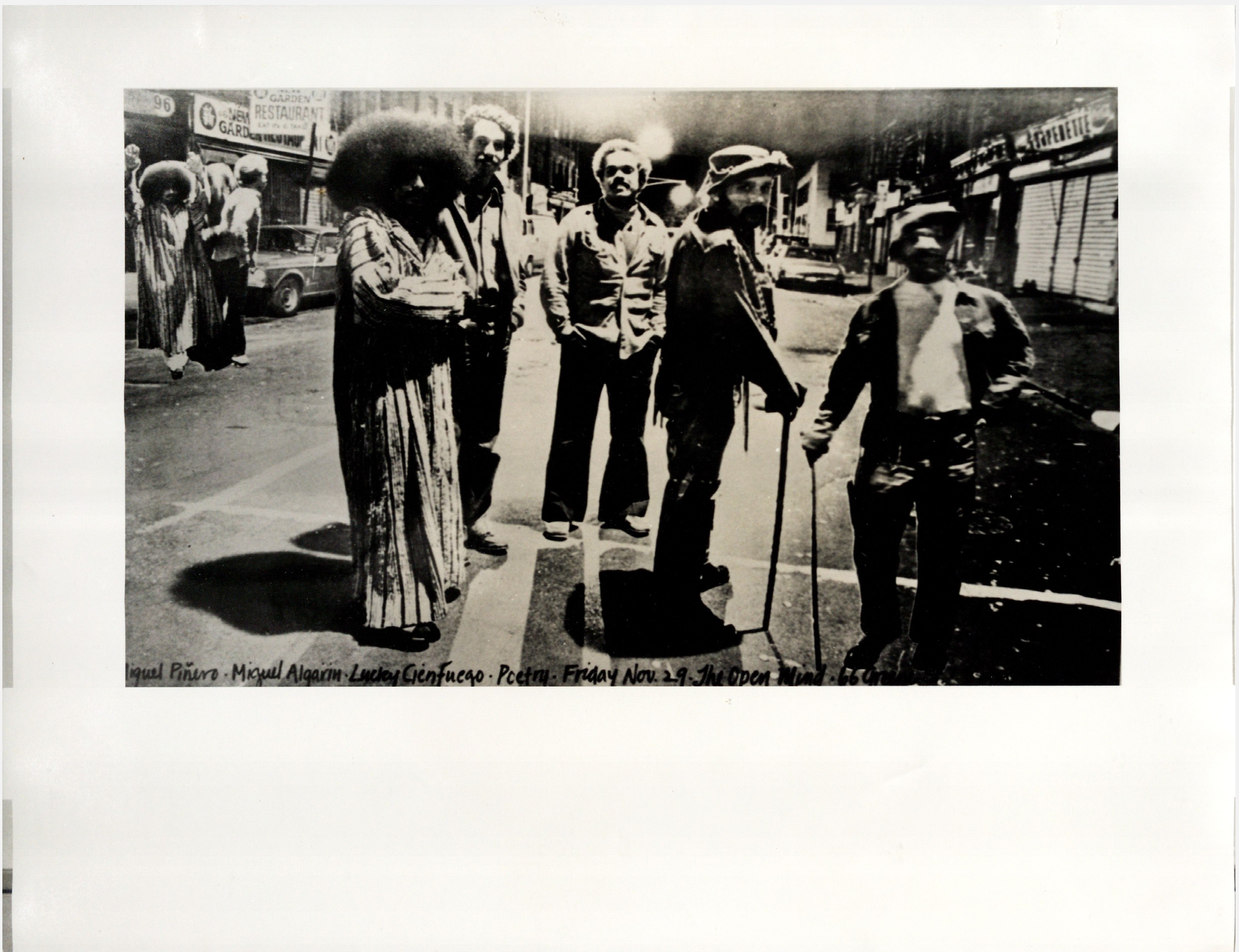 [Photograph of Nuyorican Poets Café founders: Lucky Cien Fuegos, Rich August, Miguel Piñero and Miguel Algarín outside The Open Mind]<br><br>[Fotografía de los fundadores del Nuyorican Poets Café: Lucky Cienfuegos, Rich August, Miguel Piñero y Miguel Algarín afuera de The Open Mind] 